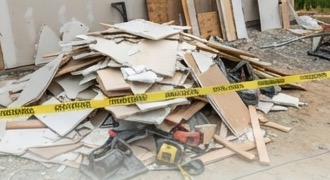 Pile of construction debris and drywall on a job site